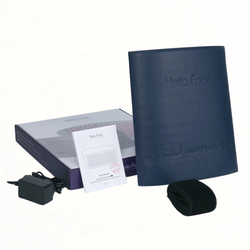Large navy blue Hello Face LED light therapy mat, power adapter, manual, and strap, displayed with product packaging.