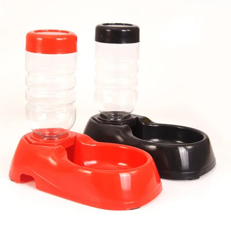 Automatic pet water dispenser and food bowl set in red and black plastic for convenient cat and dog feeding.
