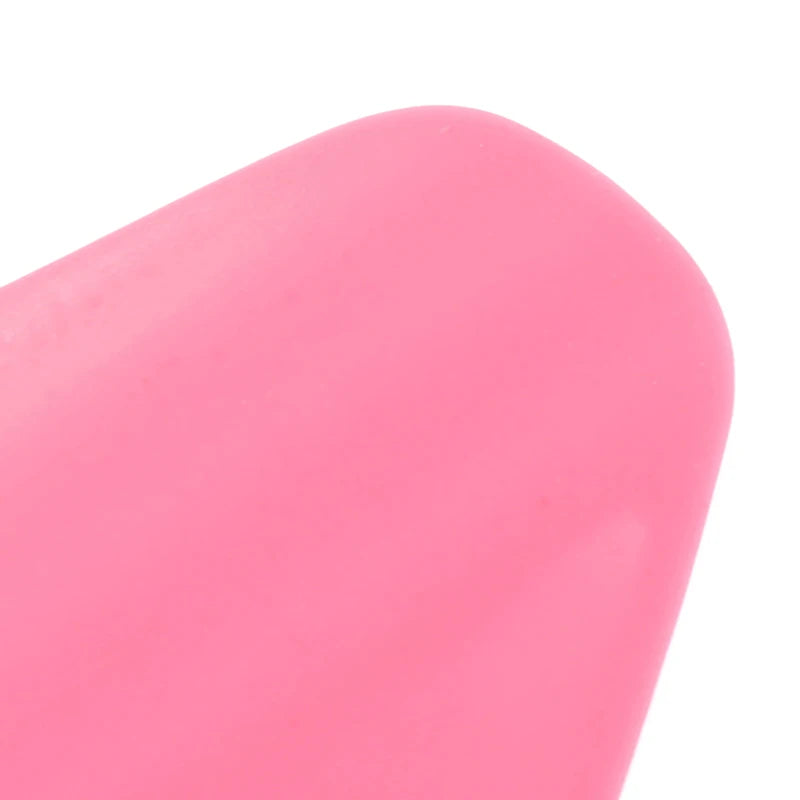 Pink silicone nose shaper clip, nasal bridge lifting and straightening beauty tool for facial contouring.