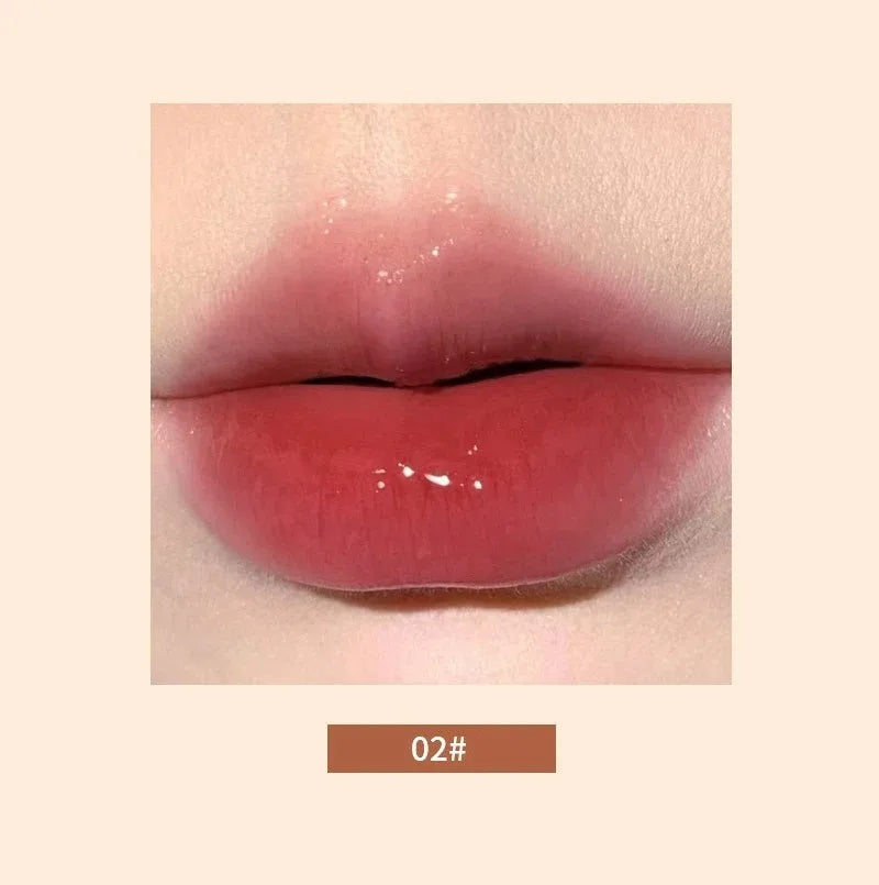 Glossy, mirror-finish lip glaze in shade 02, featuring a moisturizing, jelly-like texture for hydrating Korean lip makeup.