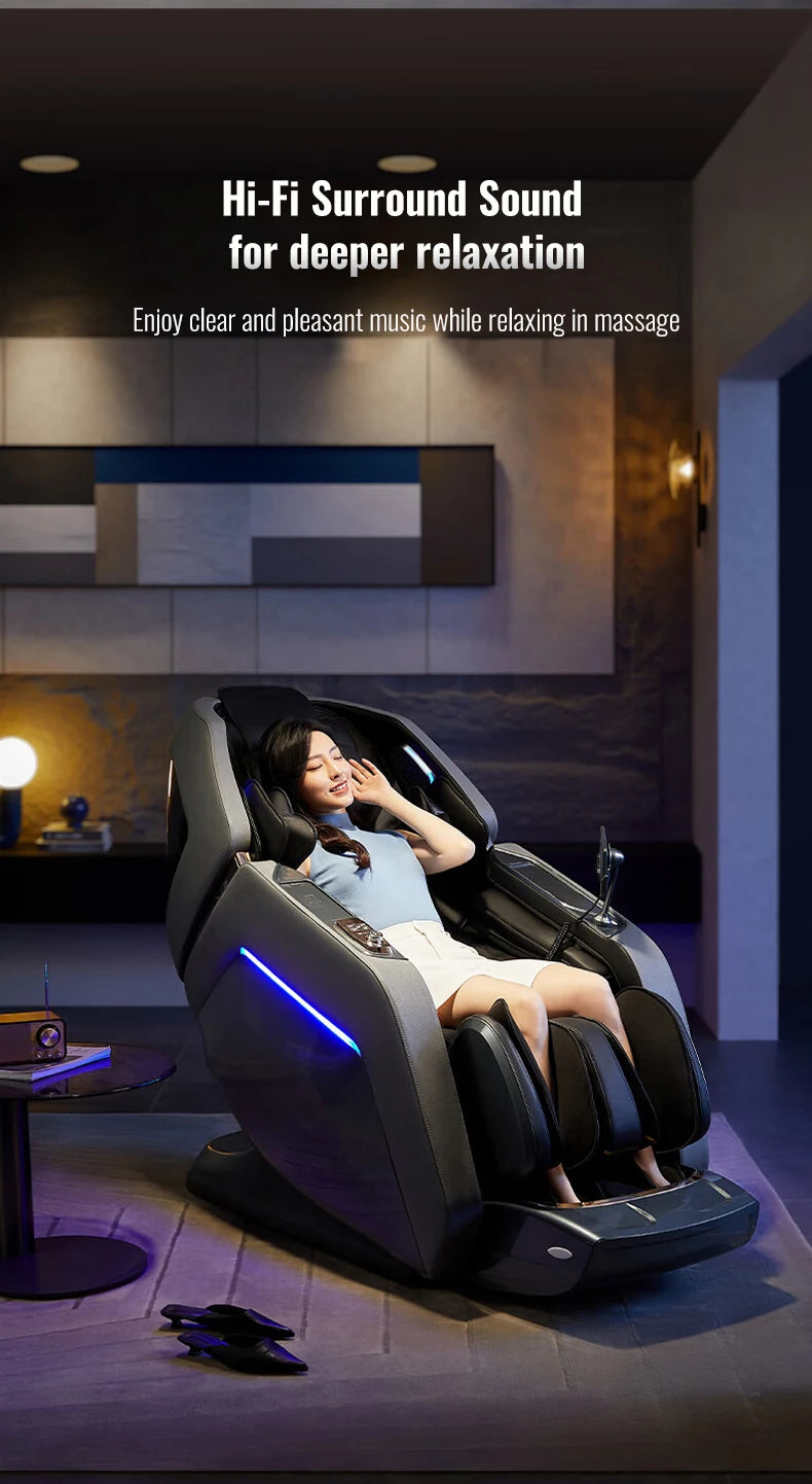 A woman relaxes in a sleek, grey zero-gravity massage chair with glowing blue accent lights in a modern living room.