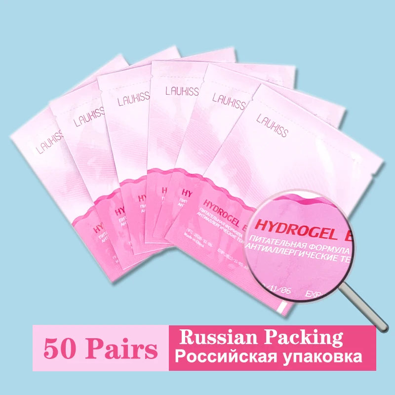 Fan of pink Laukiss hydrogel under-eye lash extension pads in individual lint-free sachets. Professional beauty supply.