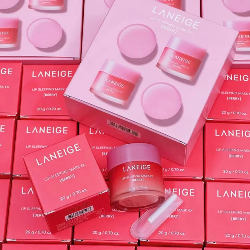 Laneige Lip Sleeping Mask Berry gift set in pink packaging with moisturizing balm jars and applicator spatula.