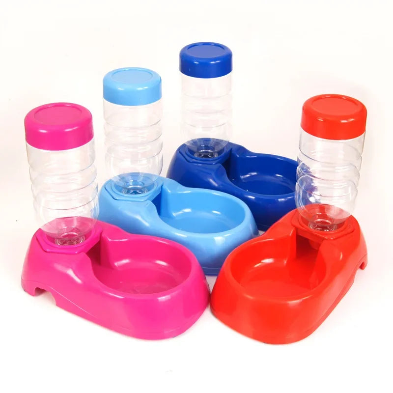 Automatic plastic pet water dispenser set for cats and dogs in pink, blue, and red for easy self-hydration.