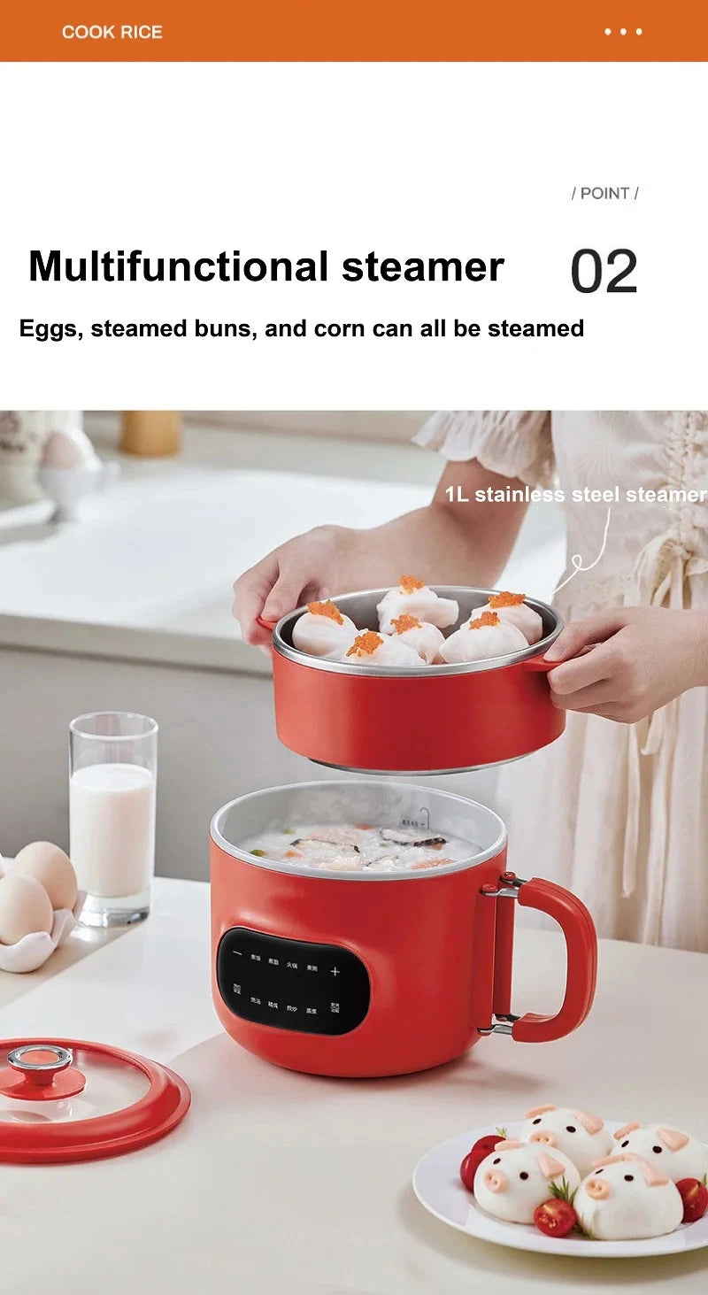 Red electric cooking pot with lid and steamer bowl, eggs and buns inside