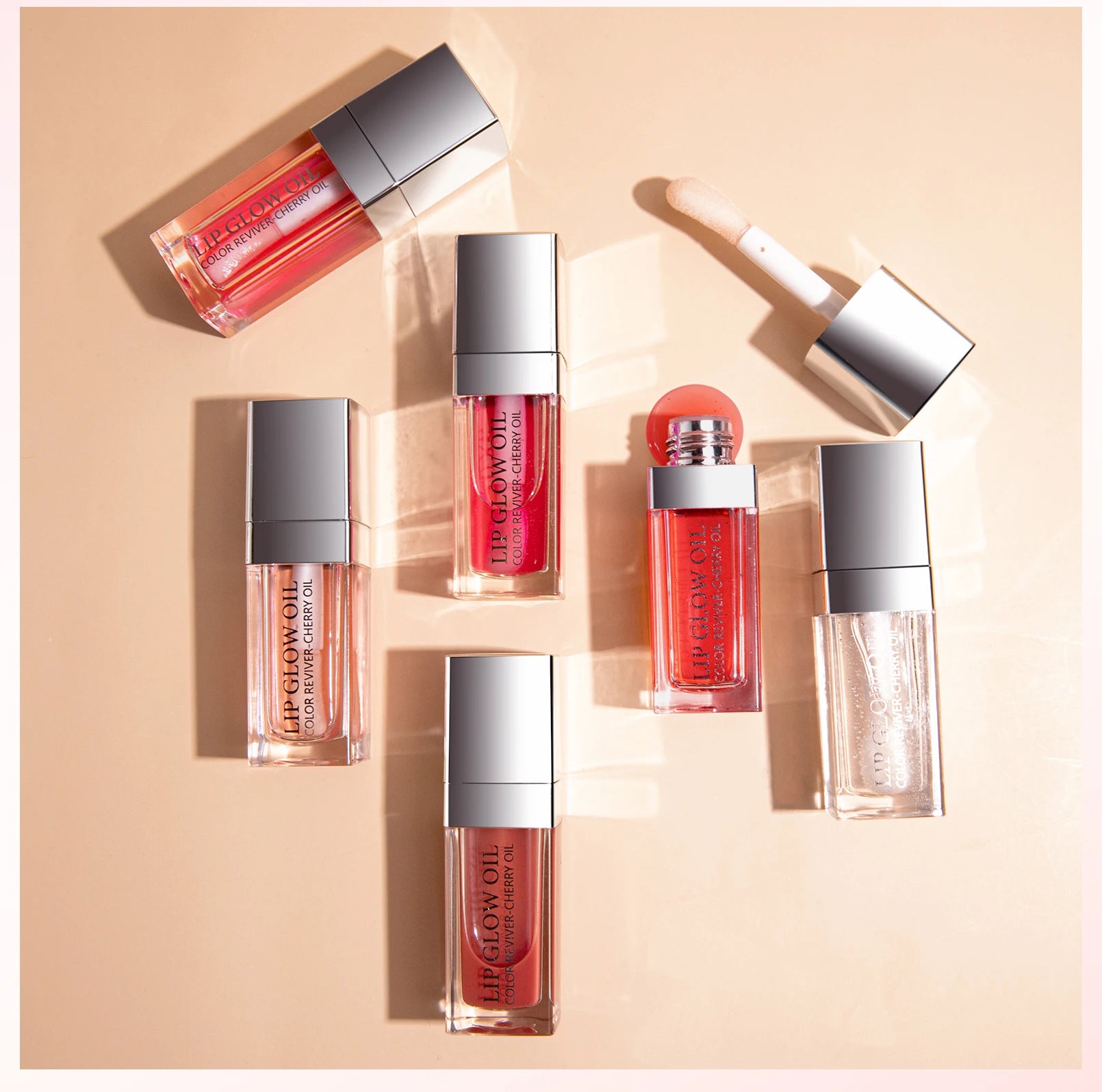 Crystal jelly moisturizing lip oil set: glossy, tinted plumping lip glow oils in various shades with doe-foot applicator.