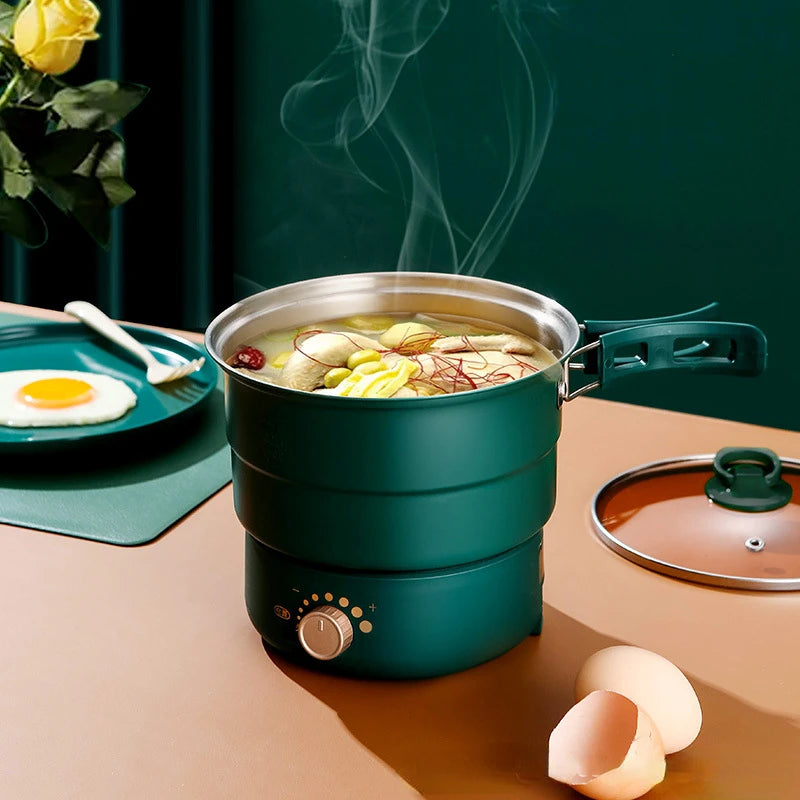 Teal electric hotpot steamer pot with lid, visible food inside