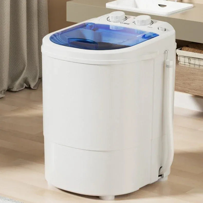 Portable washing machine with white body and blue lid in compact bathroom setting.