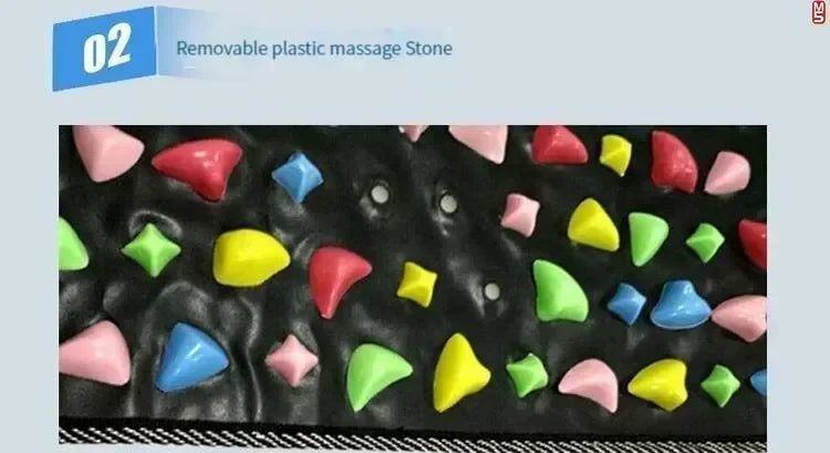 Acupressure foot reflexology massage pad featuring removable colorful plastic stones on a black mat for pain relief.