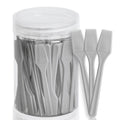 A clear plastic jar filled with 100 small, grey plastic cosmetic spatulas for applying creams and masks.