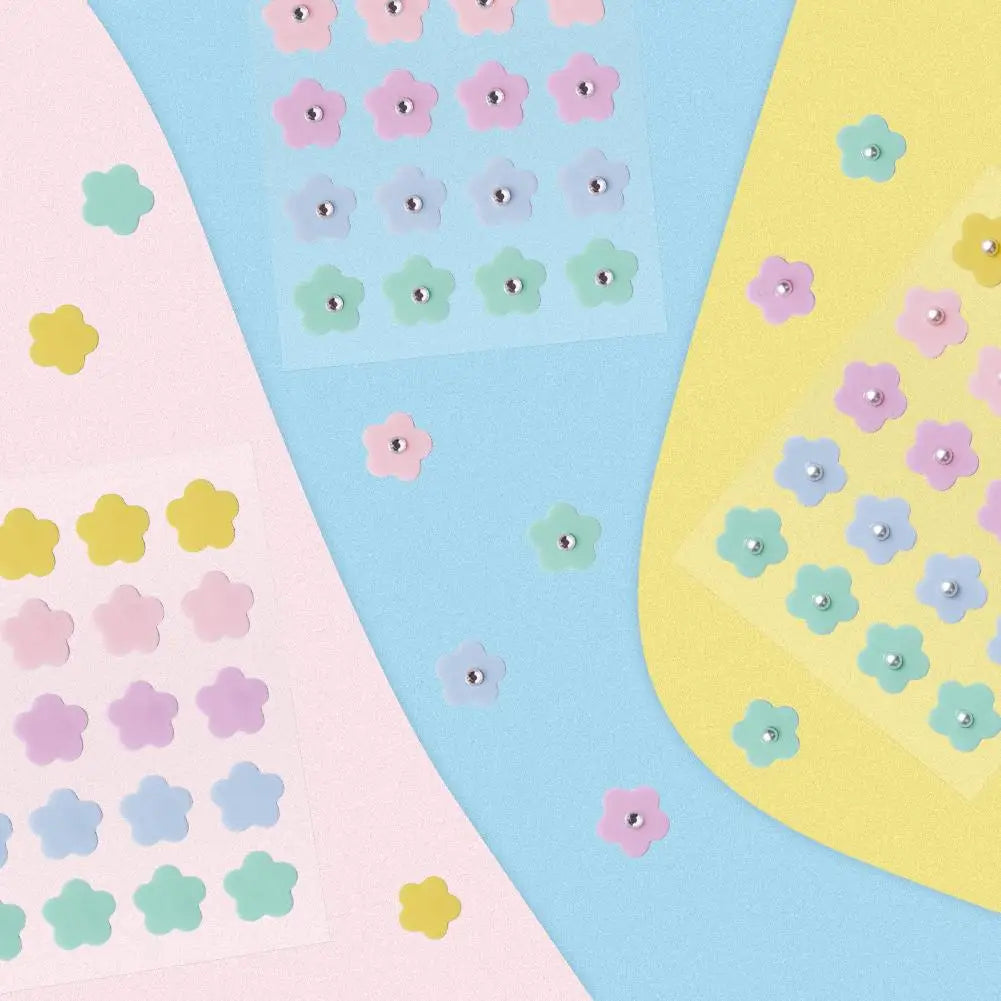 Tidesmit multicolored flower-shaped hydrogel acne patches with pearl and diamond accents for spot treatment