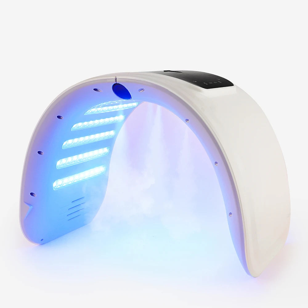 White arched LED light therapy machine with misting function for facial skin care on a white background.