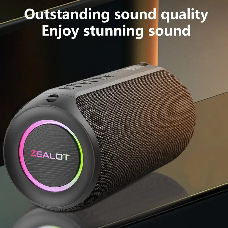 Portable wireless subwoofer speaker with gray fabric grille and pink LED ring