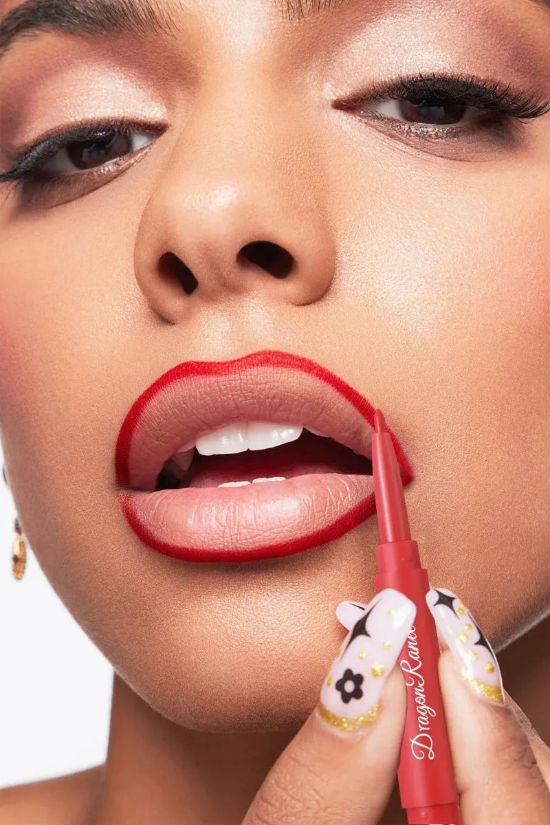 Rose red dual-ended matte lip liner pencil applying waterproof, long-lasting matte lipstick on lips.