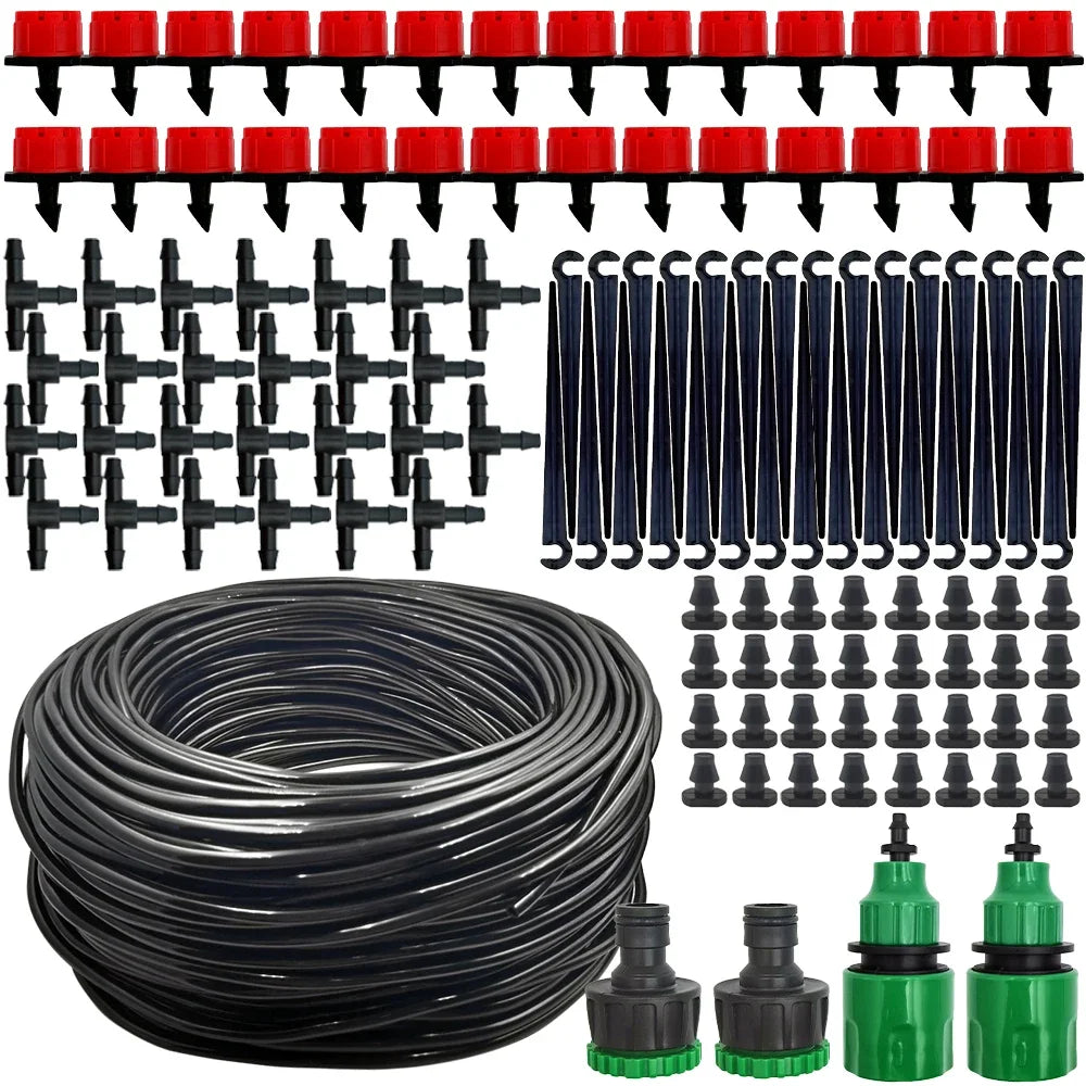 Micro drip irrigation kit components laid out: coiled black tubing, red dripper tops, black fittings.