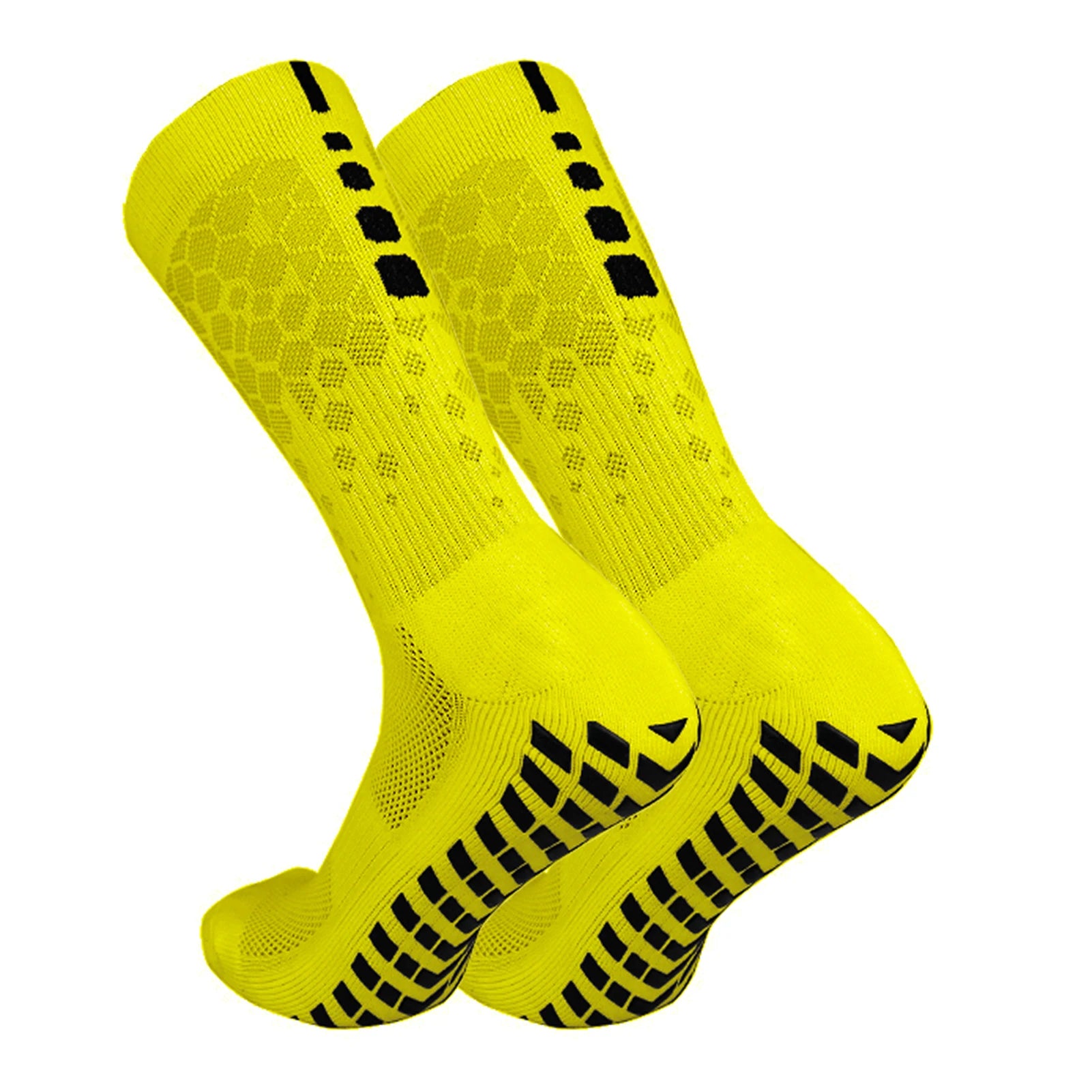 Pair of neon yellow Tidesmit athletic crew socks with black rubber grip pads on the soles and honeycomb texture.