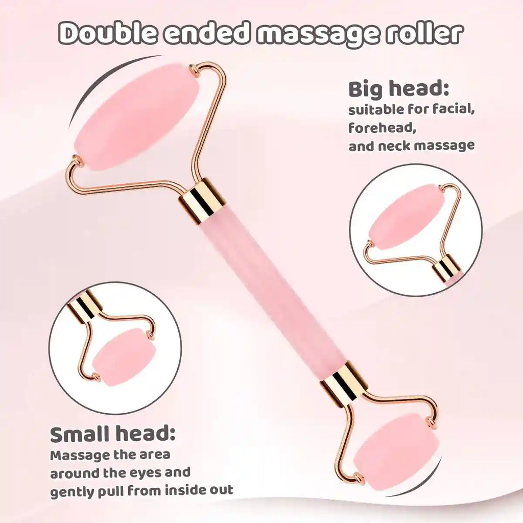 A double-ended pink facial massage roller with gold accents and two interchangeable rollers of different sizes.