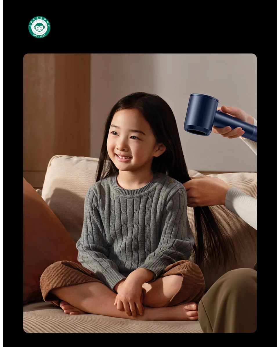 Dark blue MIJIA high-speed water ion hair dryer drying a child's hair for fast, gentle, quiet professional styling.