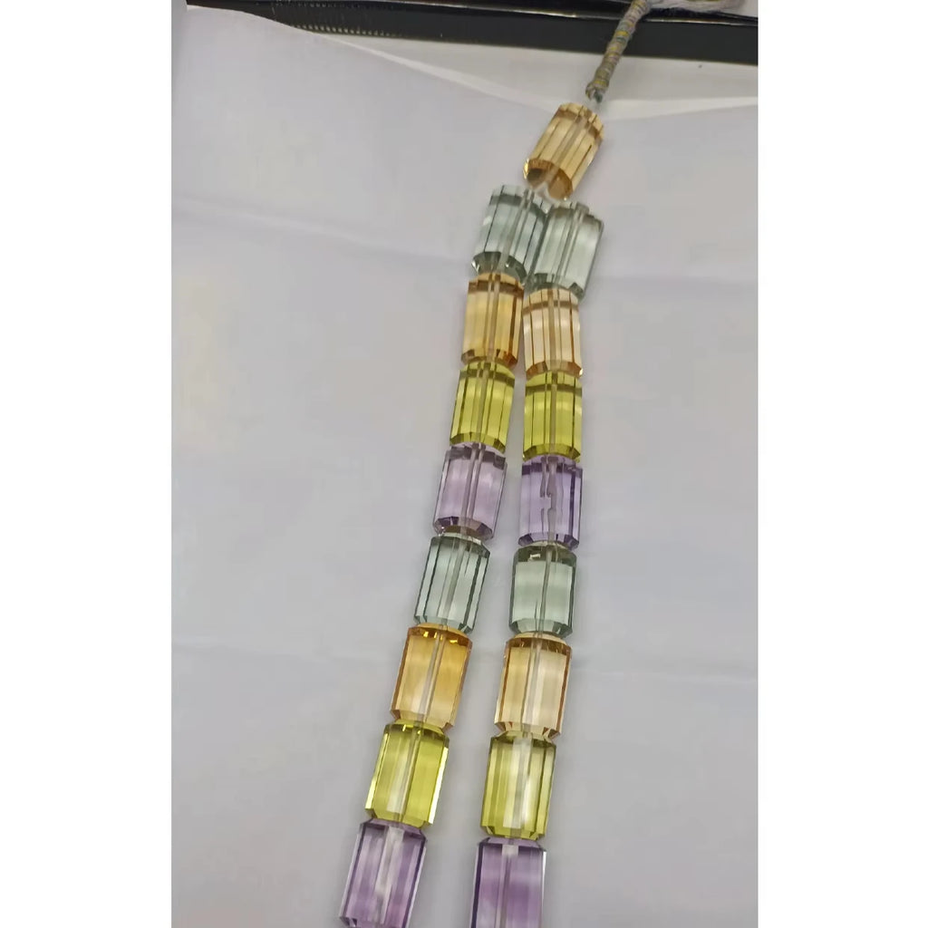 Multi-color faceted cylinder bead strand, with yellow, lavender, mint and clear beads