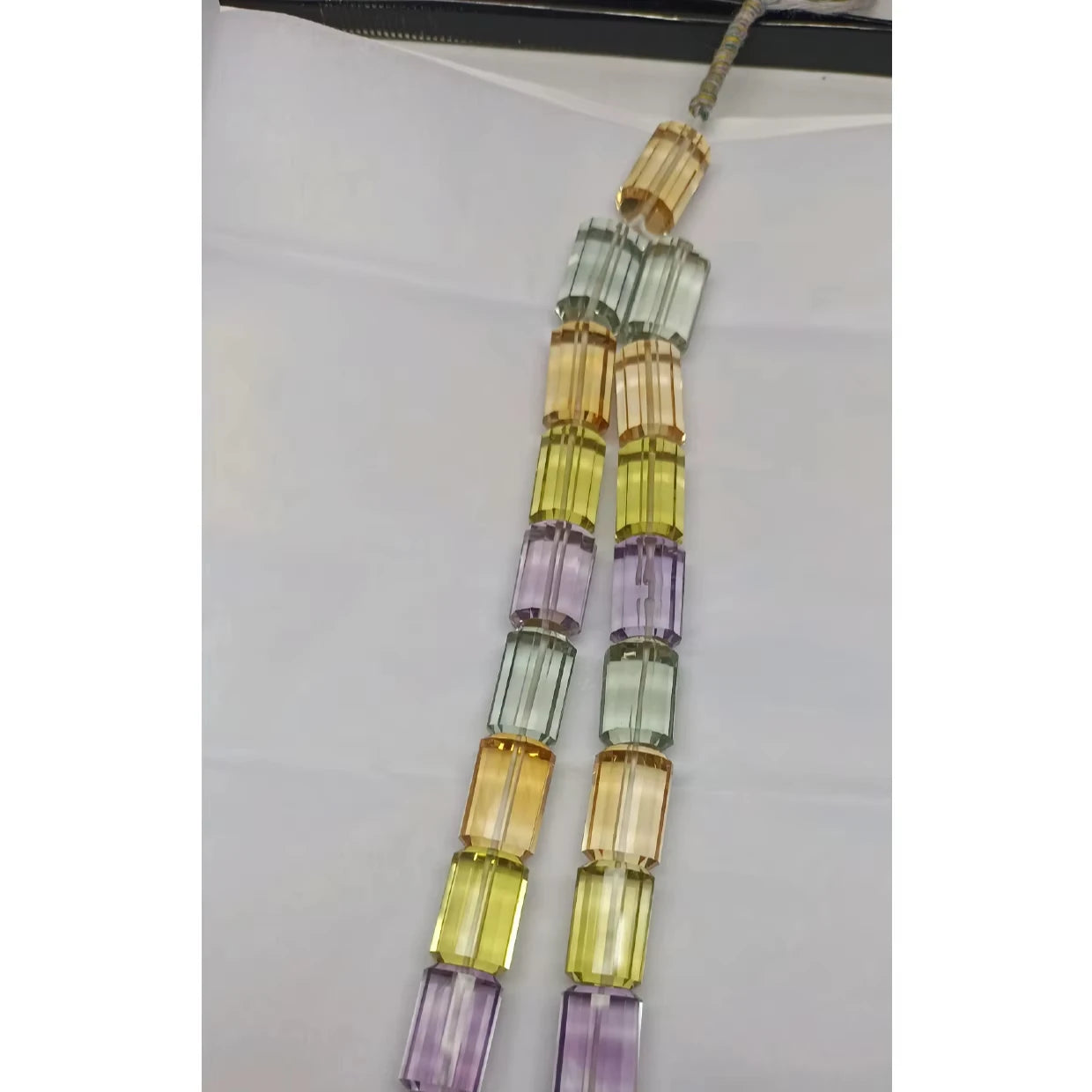 Multi-color faceted cylinder bead strand, with yellow, lavender, mint and clear beads