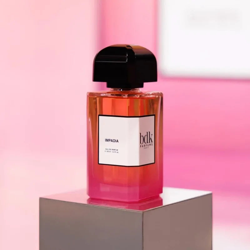 BDK Parfums Impadia EDP 100ml: Luxury niche unisex fragrance in a sleek pink gradient glass bottle with black cap.