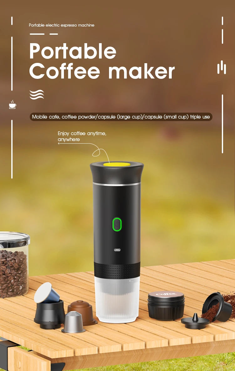 Black portable electric espresso maker with yellow button for capsules or coffee grounds on a wooden outdoor table.