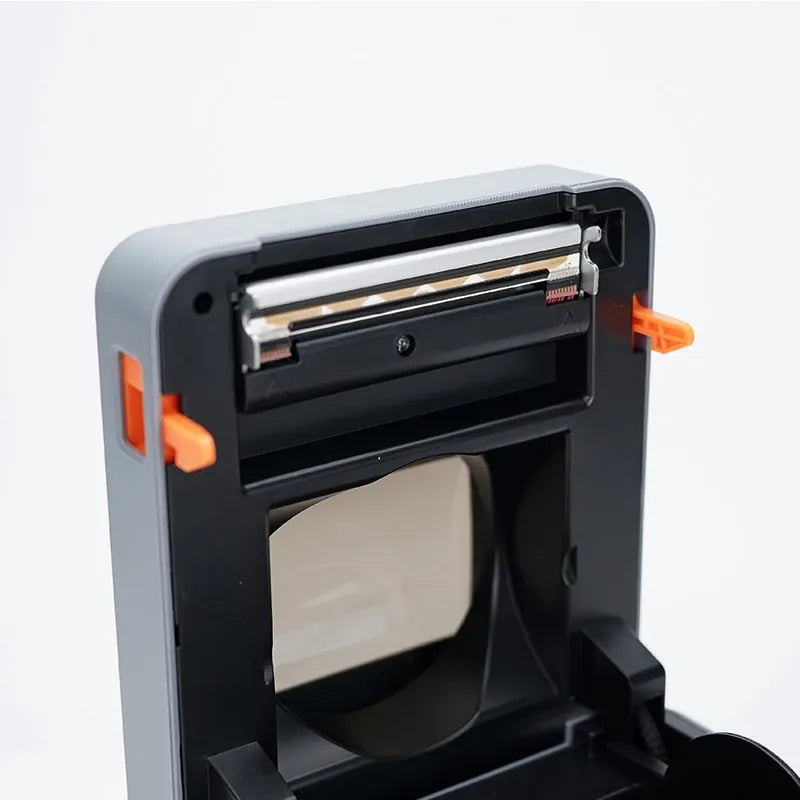 Gray thermal label printer with open paper path and label roll compartment
