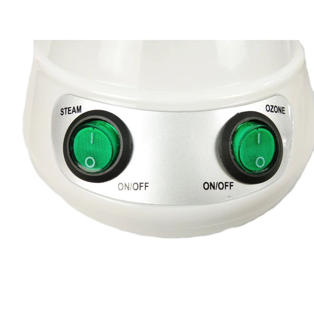 White facial steamer control panel with green steam and ozone power buttons for deep pore cleansing spa treatment.