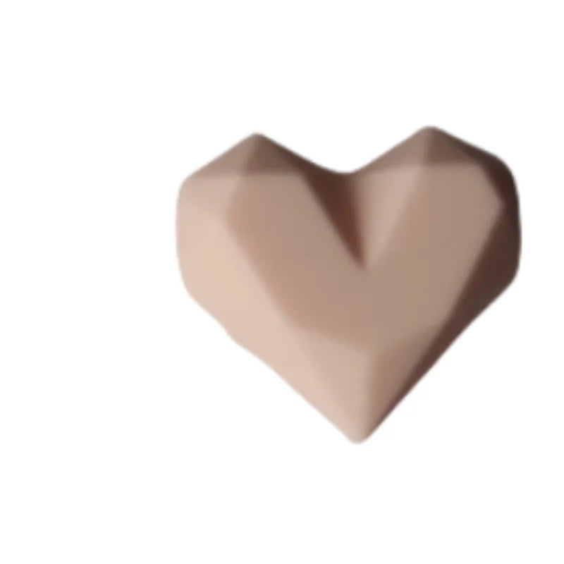 Pink heart silicone dust plug for Tamagotchi Uni, perfect for protecting your electronic pet port from dirt and debris.