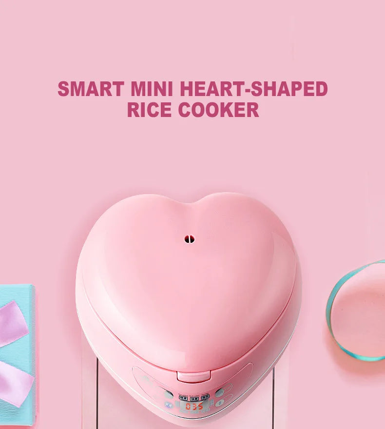 Pink heart-shaped mini rice cooker, close-up of the top lid and control area