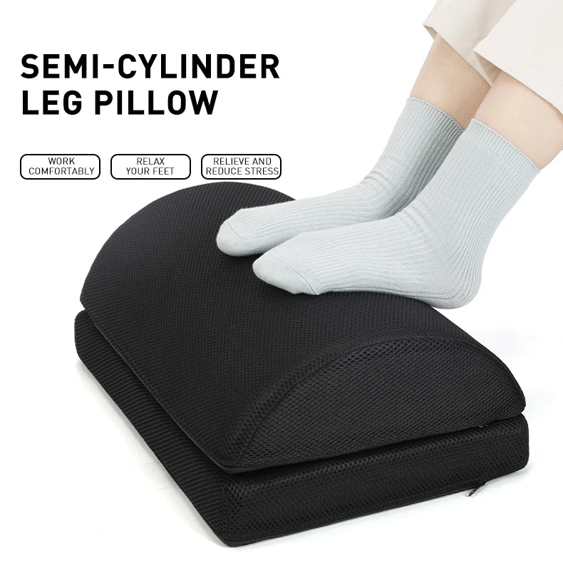 Black ergonomic semi-cylinder foot rest under desk cushion for office and gaming chair comfort and leg support.