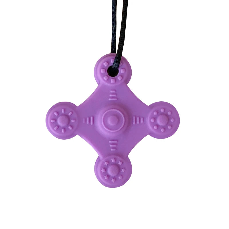 Purple silicone baby teething toy for sensory relief and gum soothing.