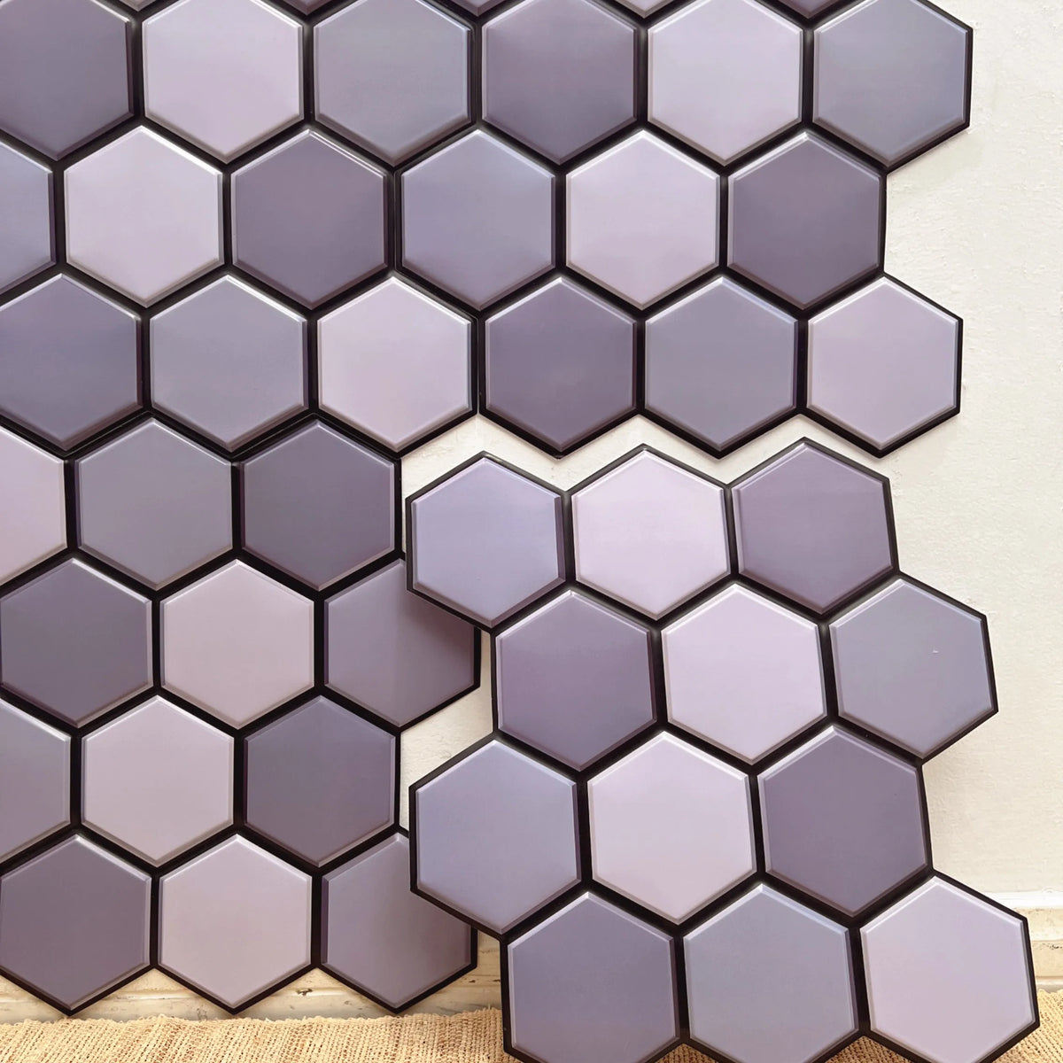 Peel-and-stick hexagon backsplash tiles, light purple and darker purple marble pattern