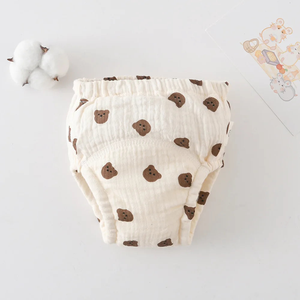 Soft cotton baby training diaper with cute brown bear print design for potty training toddlers.