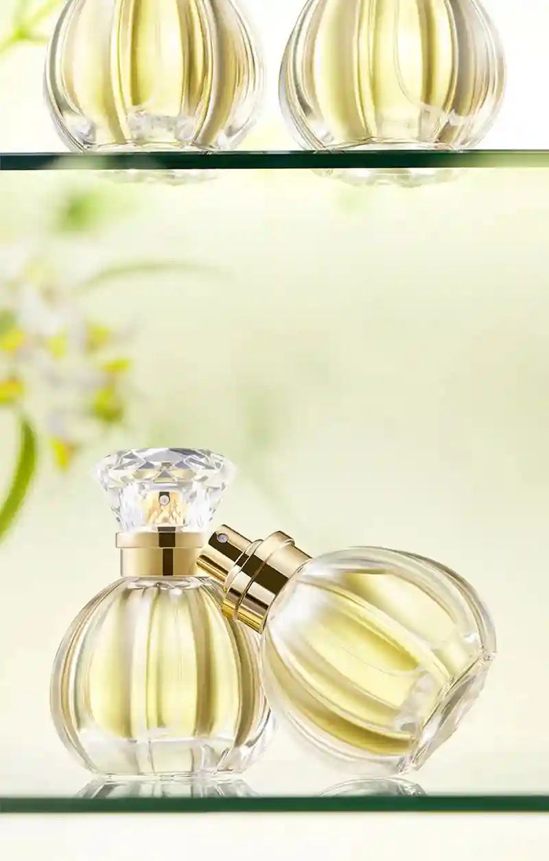 GECOMO Valley White Rose EDP 50ml: Women’s floral perfume in a round ribbed glass bottle with a crystal diamond cap.