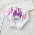 Washable floral sanitary panty for female dogs, soft reusable pet diaper with purple bow for hygiene and comfort.