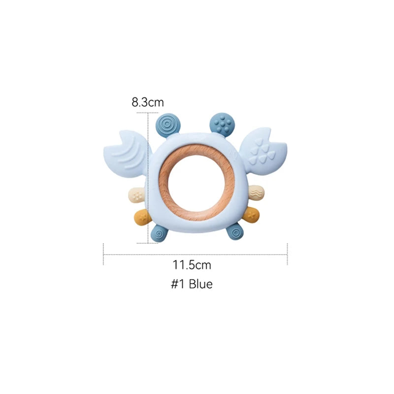 Blue crab baby teething ring made of safe silicone and natural wood for teething relief.