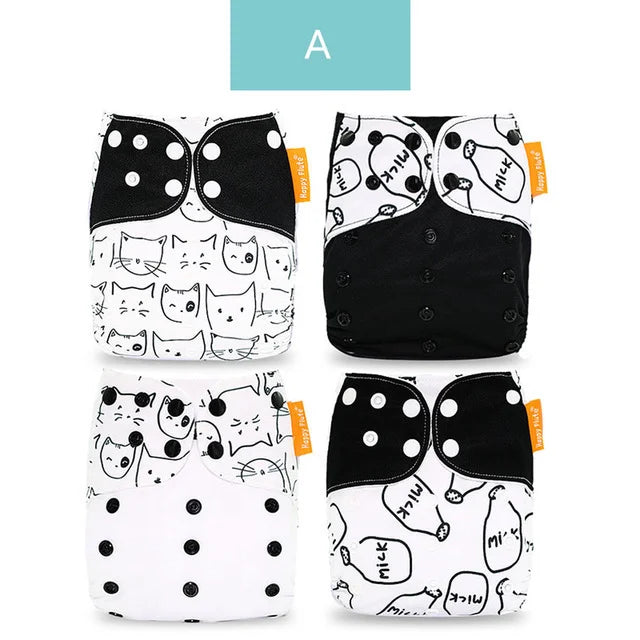 Four Happy Flute reusable cloth diapers with black and white cat and milk bottle patterns. Baby care essentials.