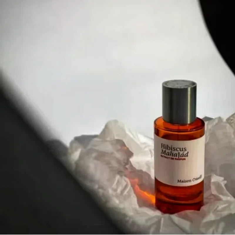 Maison Crivelli Hibiscus Mahajád Extrait de Parfum in cylindrical amber bottle, unisex floral niche fragrance spray.
