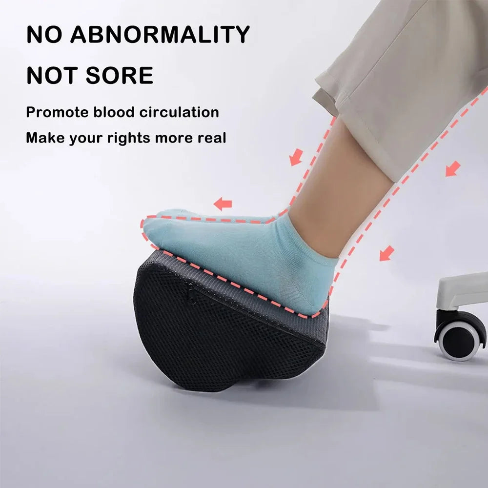 Ergonomic black memory foam foot rest for under-desk use with non-slip base, promoting comfort and blood circulation.