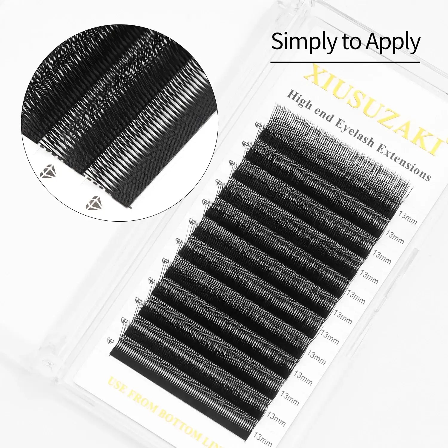 Black 13mm individual eyelash extensions arranged in rows on a clear adhesive tray for professional application.