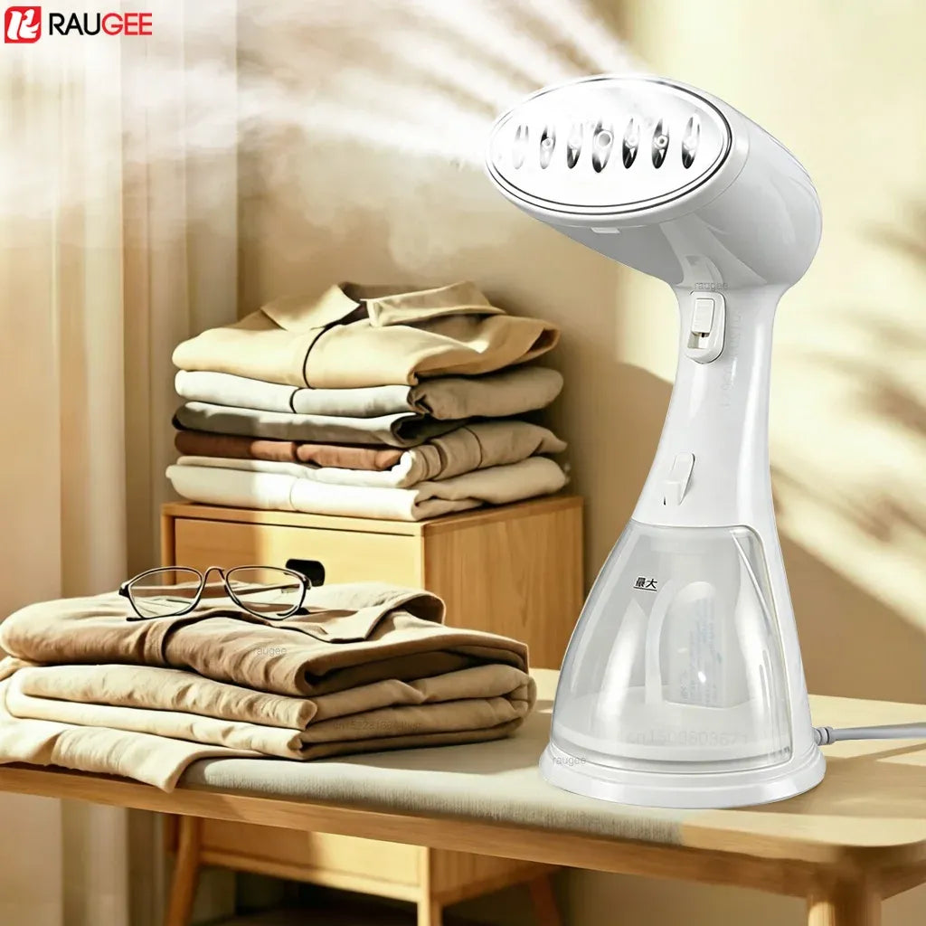 Raugee handheld garment steamer releasing powerful steam over folded clothes on a wooden ironing table.