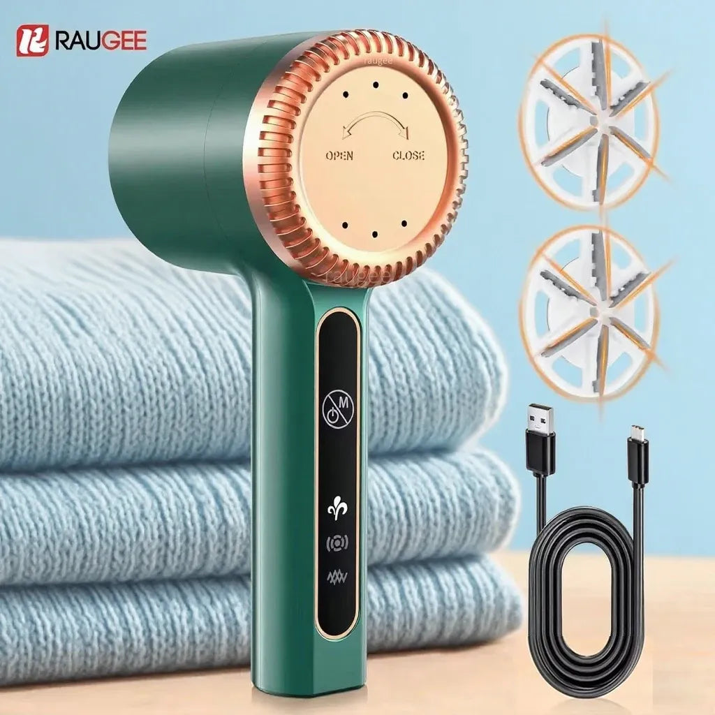 Fabric shaver lint remover in dark green, featuring replacement blades and a USB charging cable next to folded sweaters.