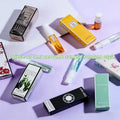 Assorted 3ml unisex Eau de Toilette perfume samples, fruity bergamot & sandalwood scents in small travel spray bottles.