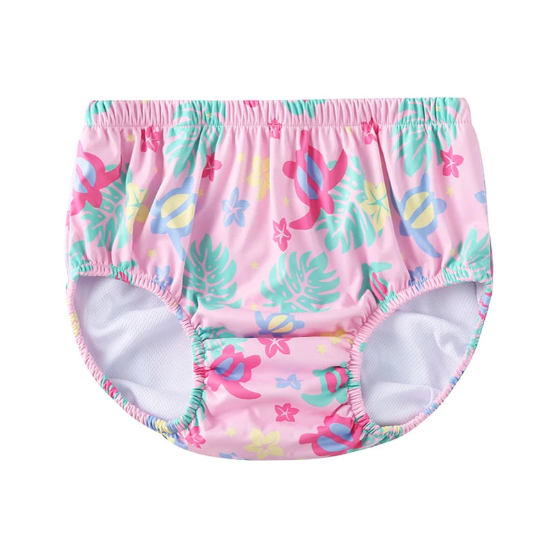 Pink baby swim diaper with colorful sea turtle and tropical flower print for infants and toddlers.