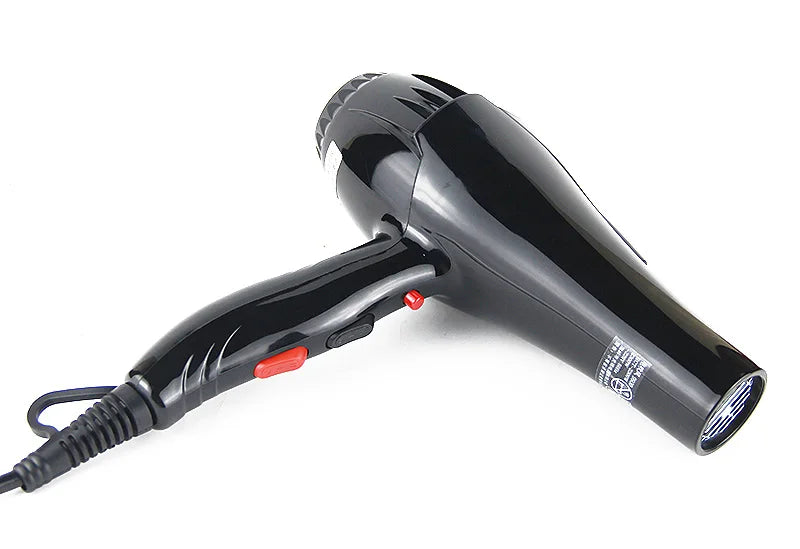 Black 2100W professional salon hair dryer with ergonomic handle, red control buttons, and long power cord for stylists.