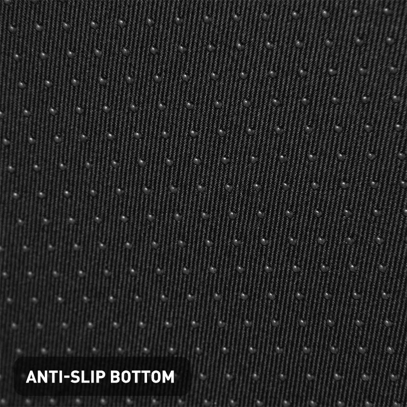 Black anti-slip bottom fabric of a memory foam office footstool for improved posture and stability.