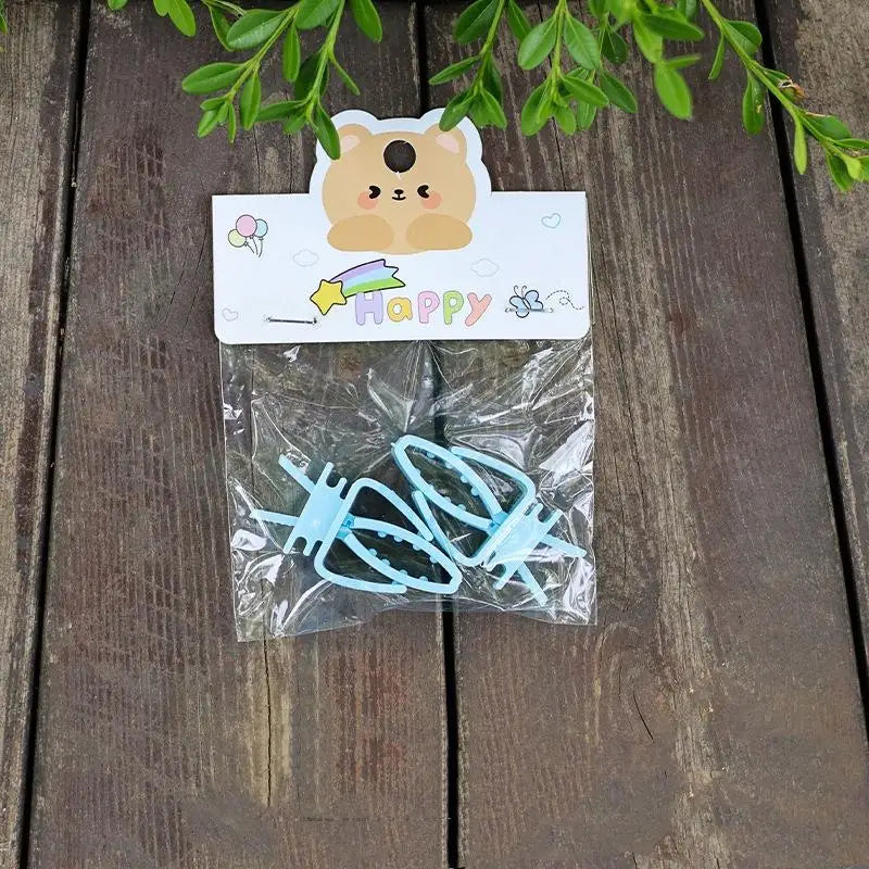 Blue plastic bird cage food clips for feeding parrot fruits, vegetables, and cuttlefish bone. Easy bird treat holder.