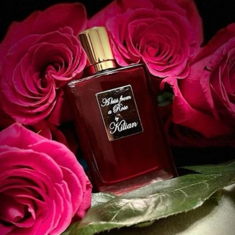 By Kilian A Kiss from a Rose EDP: Unisex floral woody niche perfume in a sleek red glass bottle with gold cap.