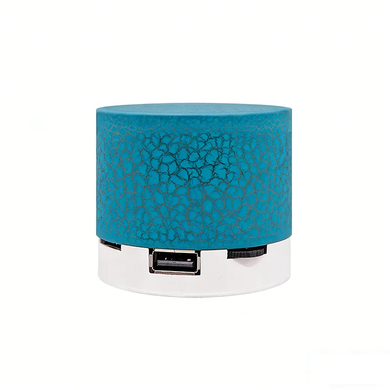 Portable wireless Bluetooth speaker, teal cylinder with USB port and strap control area